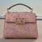 Rectangle Pink handbag displayed on a shelf